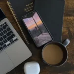 a mac book a iphone a jbl headphone in table freelance digital marketer in thrissur